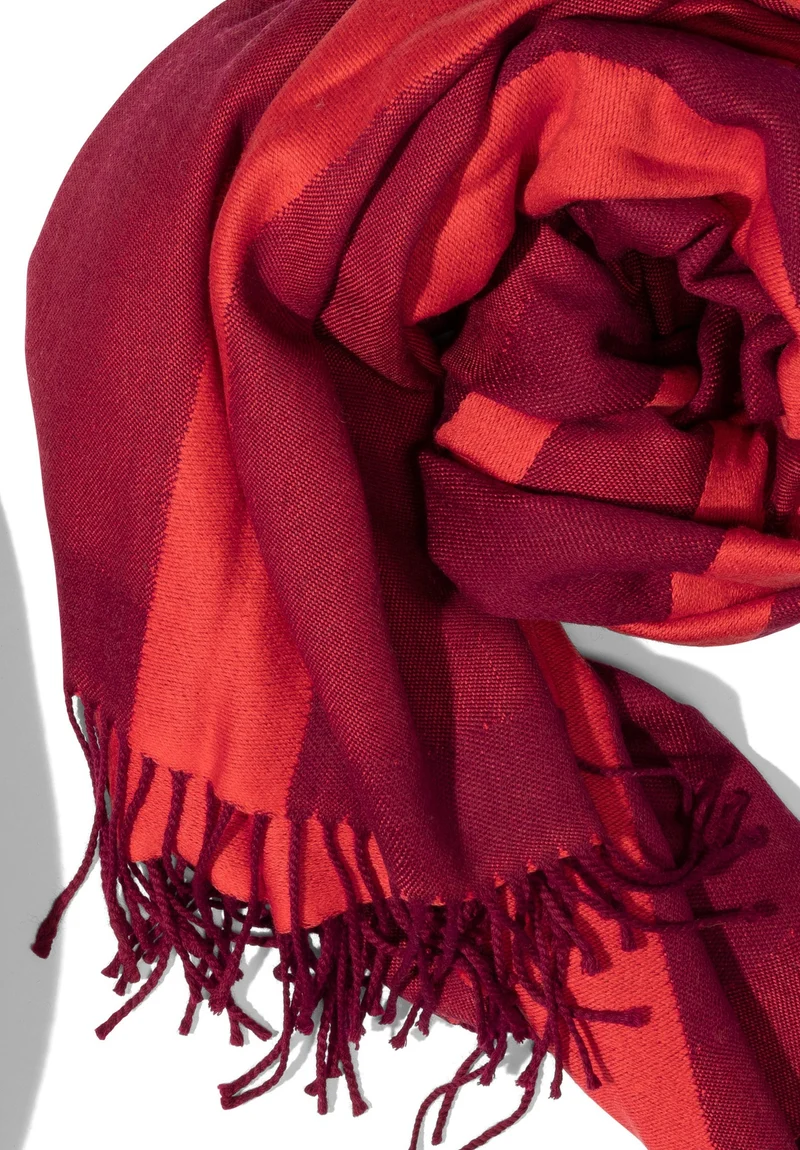Reisedecke "Light Companion" aus Extra Fine Merino "Sunrise Coral"