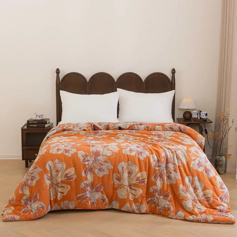Wendbare Baumwolldecke mit orange-blauem Blumenmuster