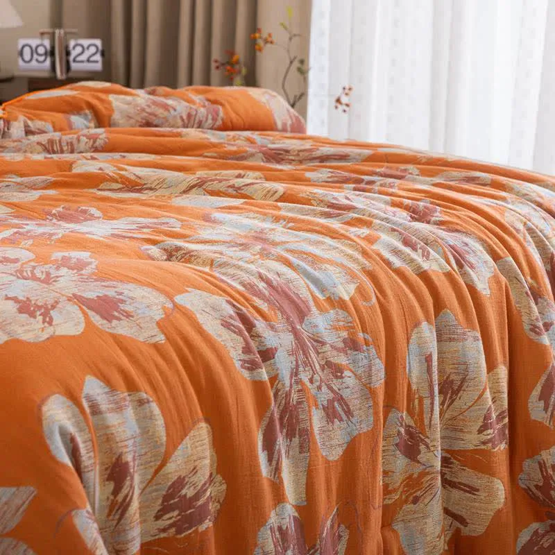 Wendbare Baumwolldecke mit orange-blauem Blumenmuster