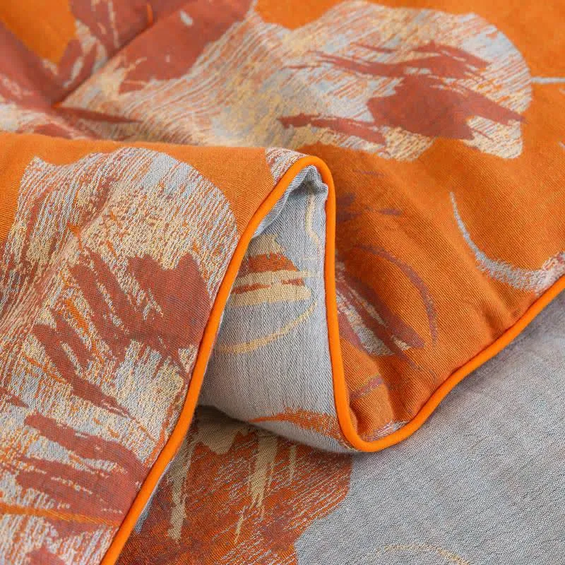 Wendbare Baumwolldecke mit orange-blauem Blumenmuster