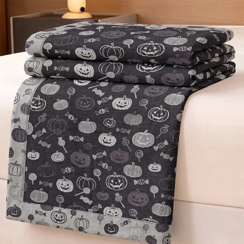 Schwarze Halloween-Kürbis-Süßigkeiten-Baumwolldecke