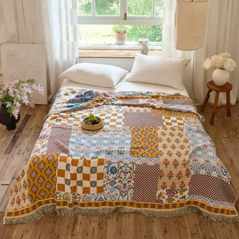 Wendbare Boho-Patchwork-Musselindecke