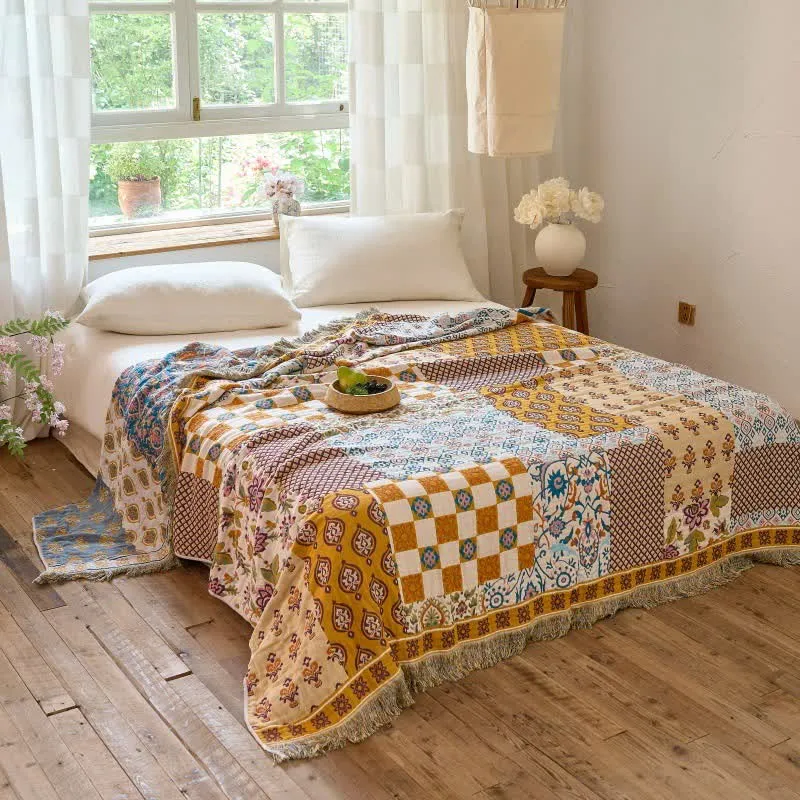 Wendbare Boho-Patchwork-Musselindecke