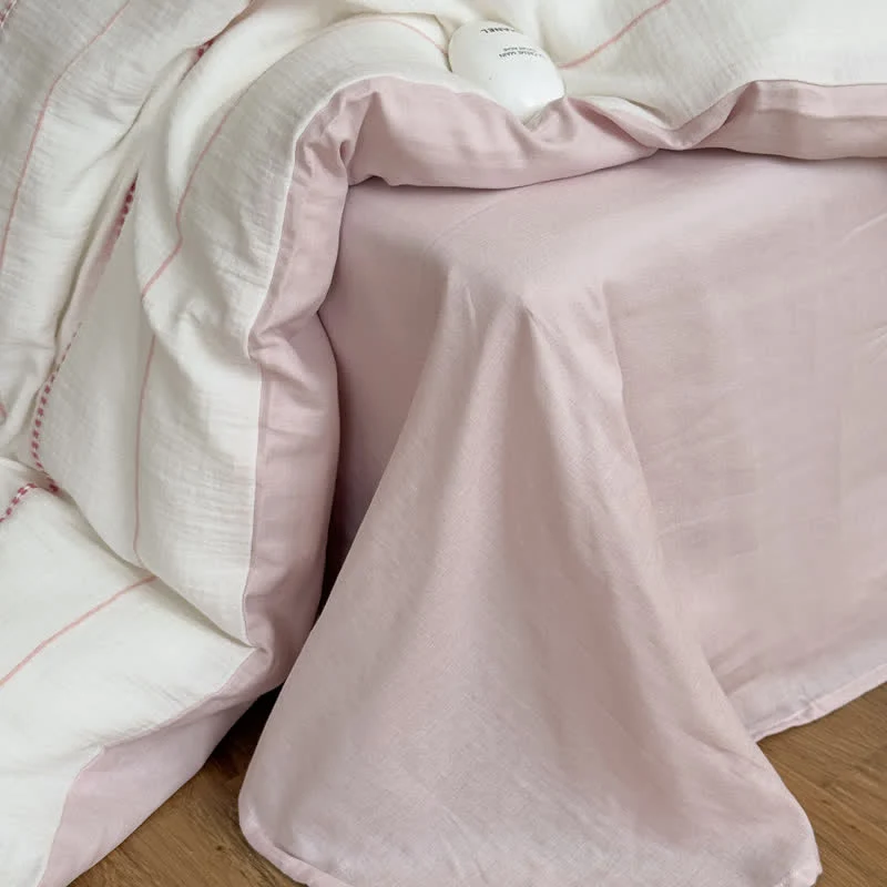 Vierteiliges Bettwäsche-Set aus gewaschener Baumwolle mit rosa Blütenmuster