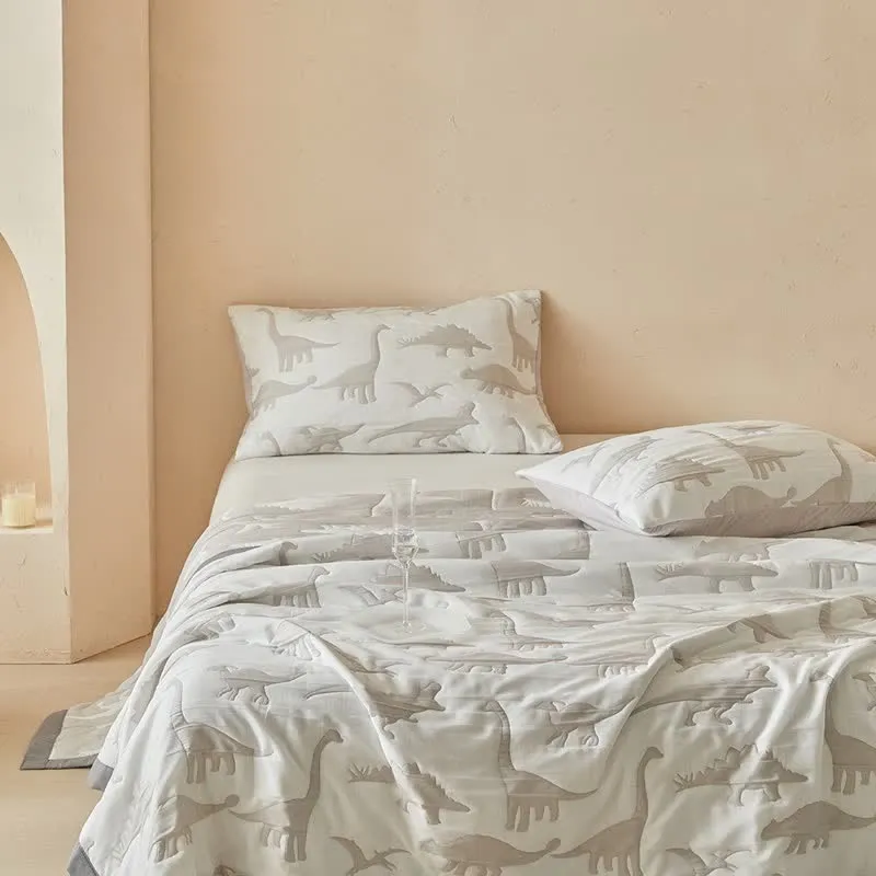 Wendbare Tagesdecke mit neutralem Dinosaurier-Print