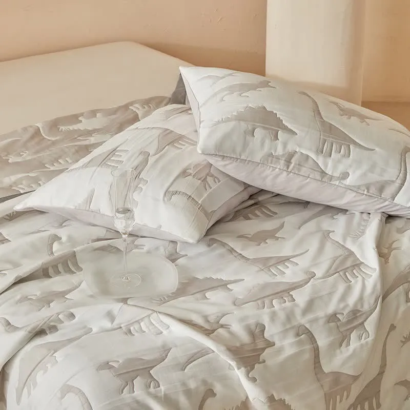 Wendbare Tagesdecke mit neutralem Dinosaurier-Print