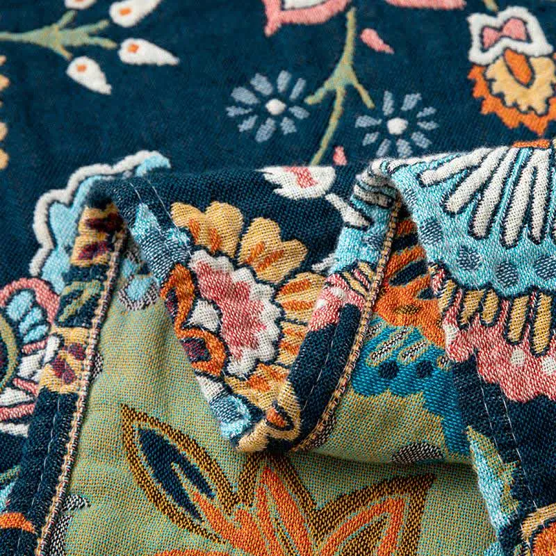 Boho-Sofadecke aus Baumwolle mit Blumenmuster und Quasten