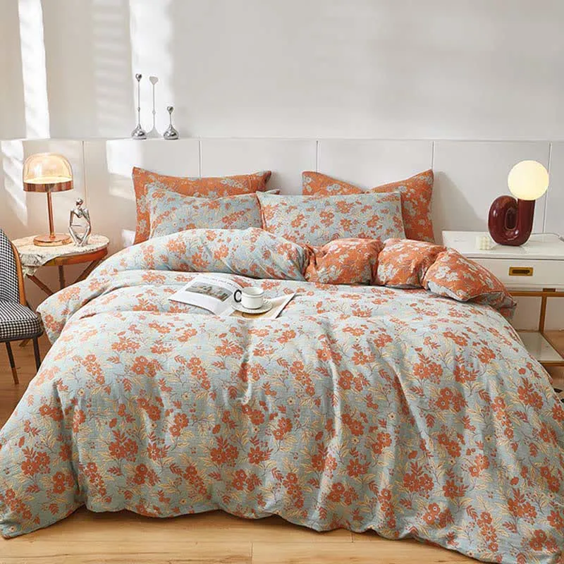 Bettwäsche aus orangefarbenem Baumwoll-Doppelgaze mit Blumenmuster