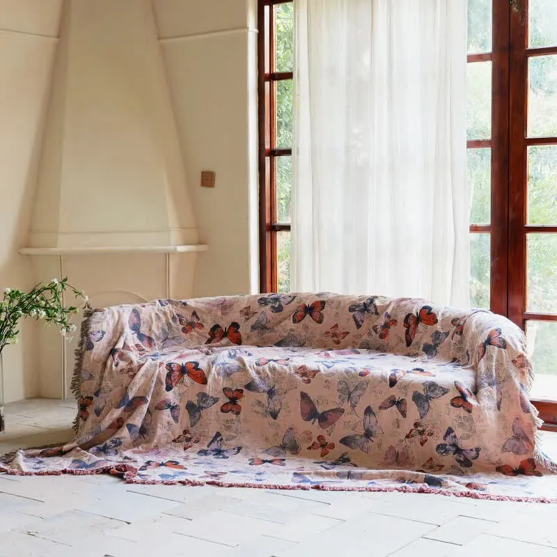 Elegante Sofadecke aus Baumwolle mit Schmetterlingsquasten