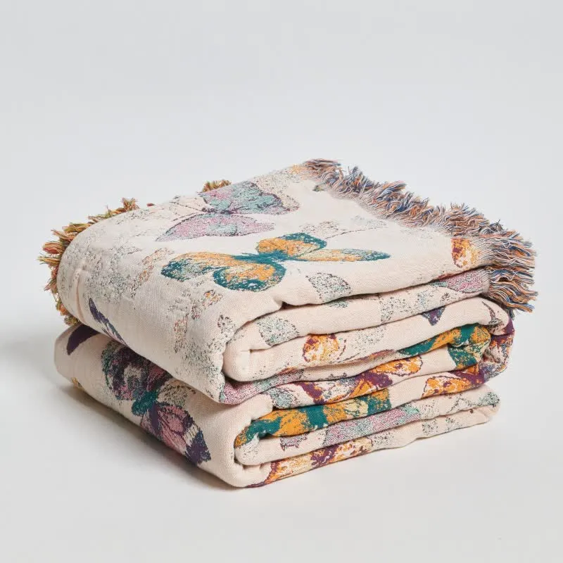 Elegante Sofadecke aus Baumwolle mit Schmetterlingsquasten