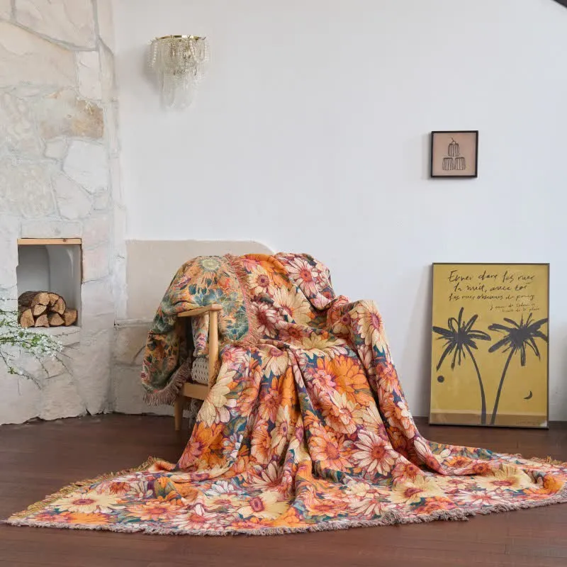 Sofadecke aus Baumwolle mit Sonnenblumenmuster und Quasten