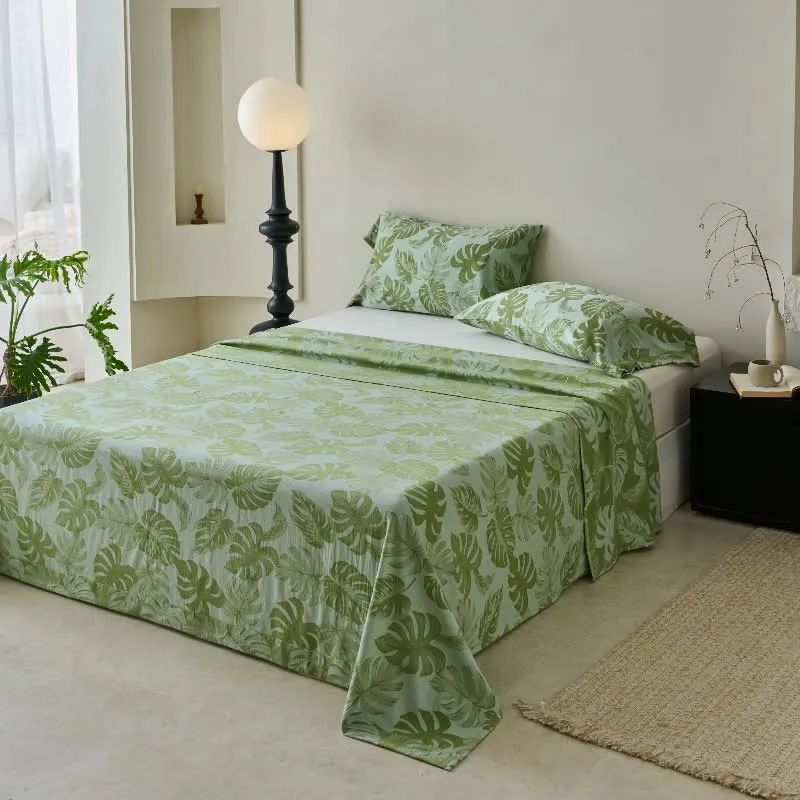 Grüne Tagesdecke aus Baumwollgaze-Jacquard mit Monstera-Motiv