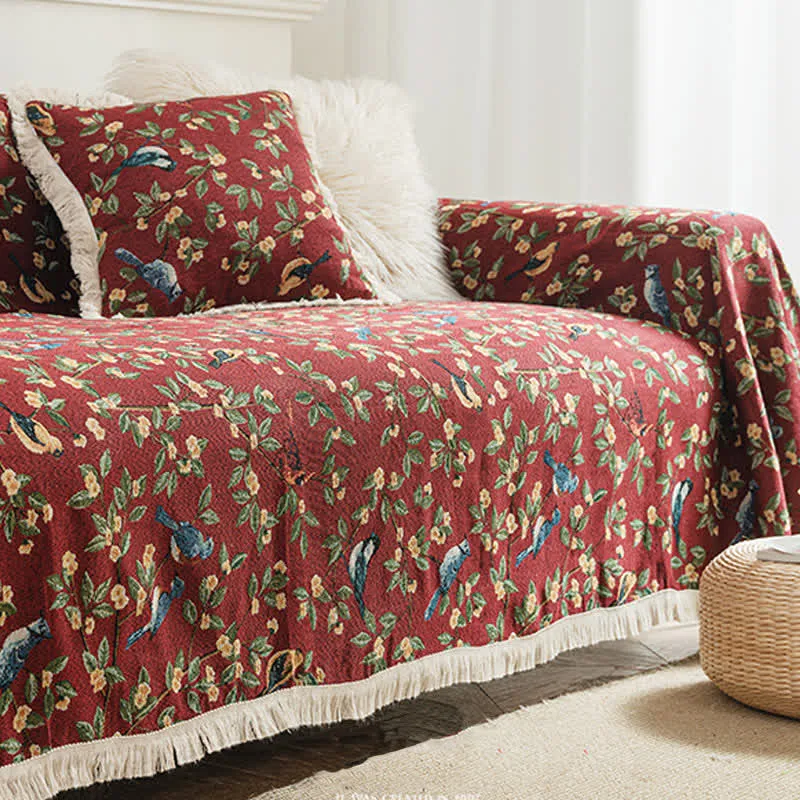 Weicher Sofaschoner mit Quasten und Blumen- und Vogelmotiv