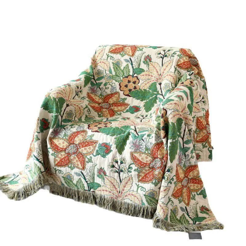 Sofadecke aus Baumwollgaze mit Blumen- und Blattmotiv und Quasten