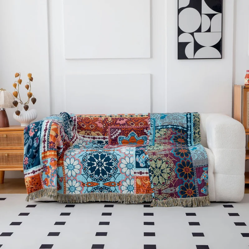 Wendbare Boho-Baumwolldecke mit blauem Blumenmuster und Quasten