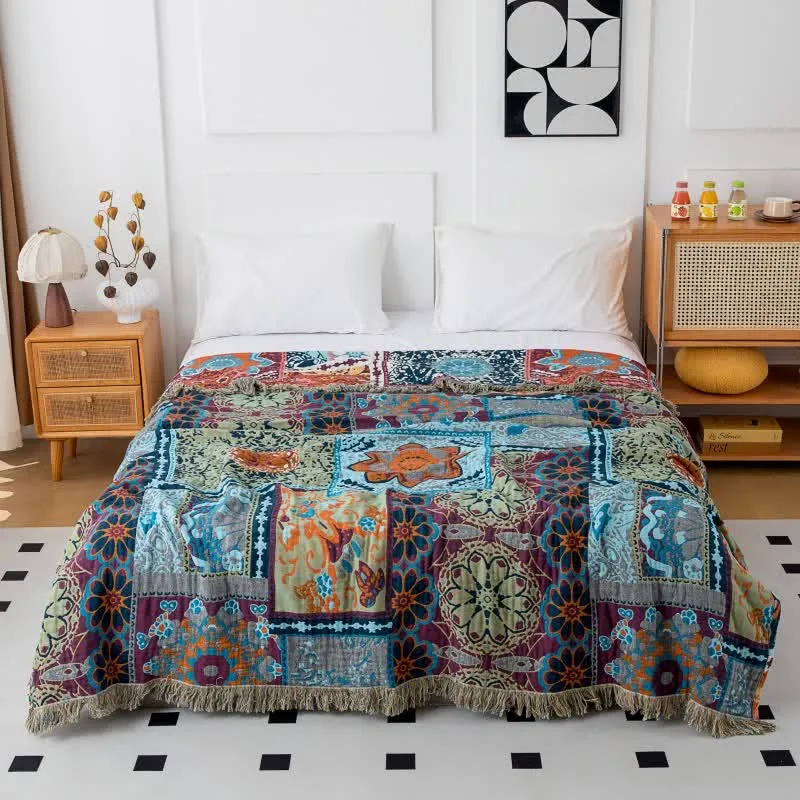 Wendbare Boho-Baumwolldecke mit blauem Blumenmuster und Quasten