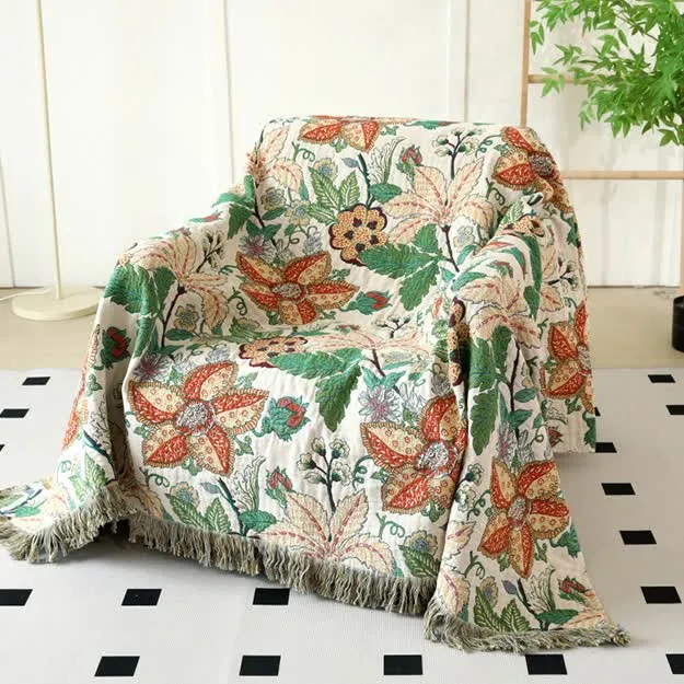 Wendesteppdecke aus Baumwollgaze mit Blumen- und Blattmotiv und Quasten