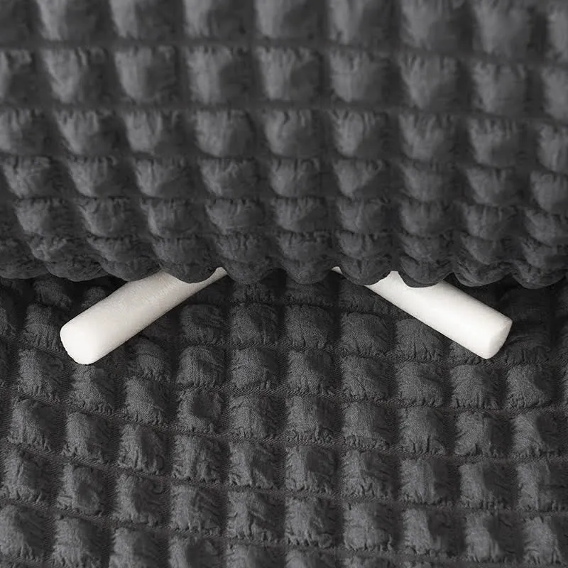 Elastischer Sofabezug mit Rüschen im schlichten Stil
