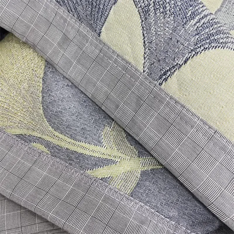 Wendbare Steppdecke aus Baumwollgaze mit Ginkgoblatt-Motiv